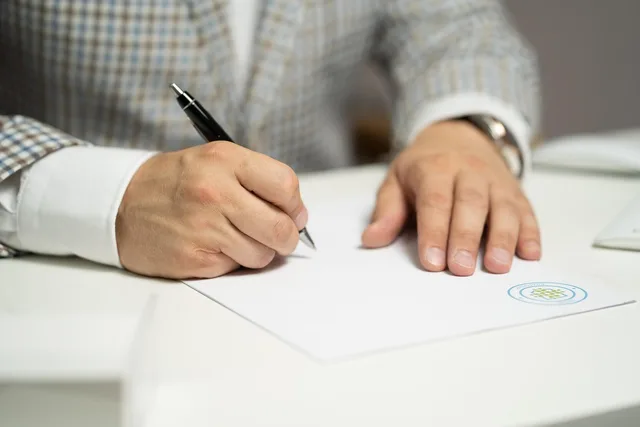 man, sign, paper, write, document, contract, signing, agreement, signature, signing document, signing contract, signing paper, sign, contract, contract, contract, contract, contract, signing, agreement, signature, signature. Community manager guide to bilingual communities in Wales
